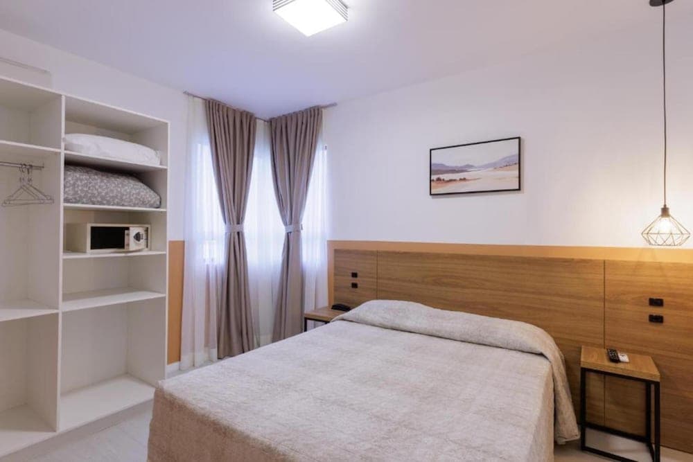 Le Village Flats e Hotel