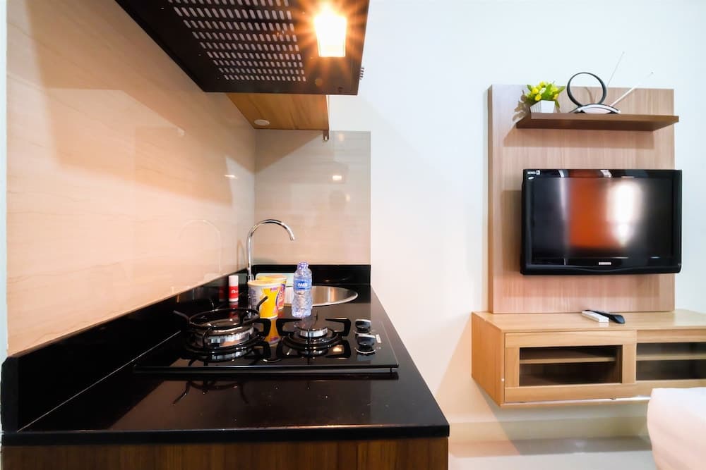 Studio Room at Green Pramuka City Apartment with Mall Access By Travelio