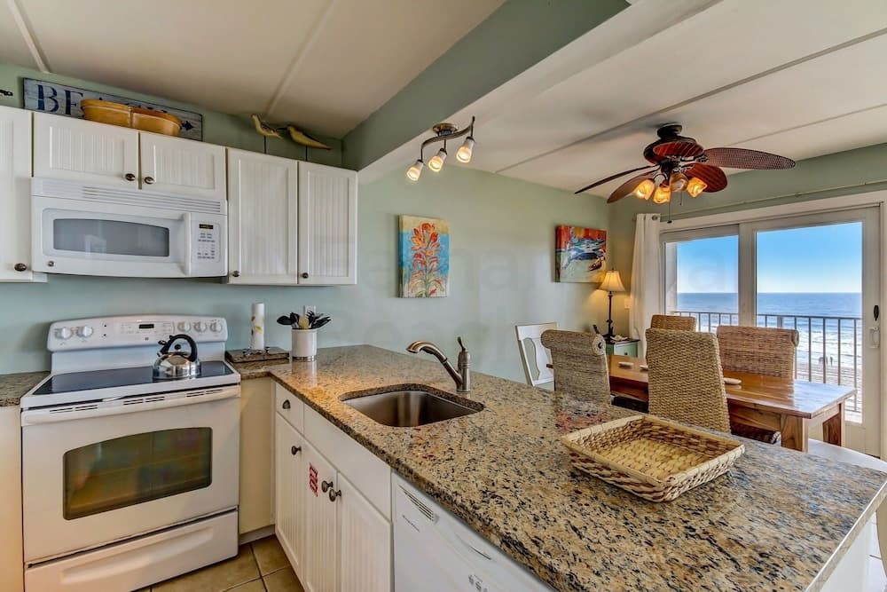 End Unit Oceanside Condo with Spectacular Ocean View from Living Area by RedAwning