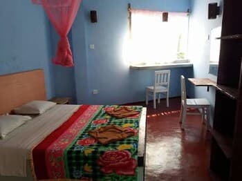 Malika's Yellow House