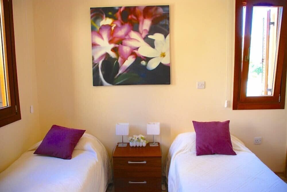 Charming 2 bedroom ground floor apartment 'CB01' - with private garden, communal pool and resort facilities, Theseus Village on Aphrodite Hill