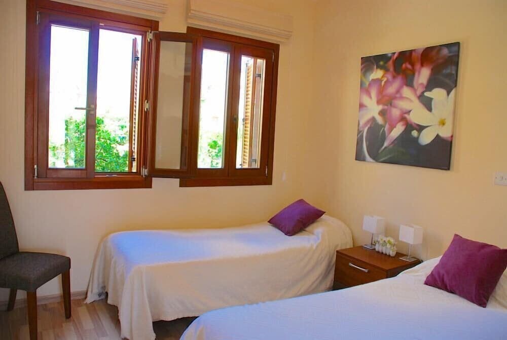 Charming 2 bedroom ground floor apartment 'CB01' - with private garden, communal pool and resort facilities, Theseus Village on Aphrodite Hill