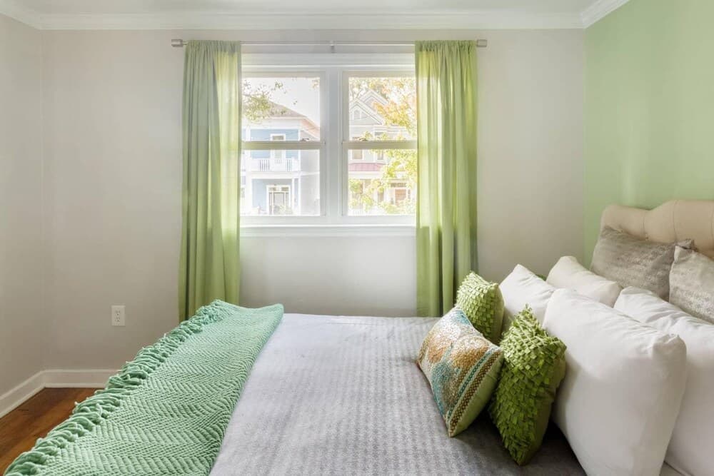 Vibrant, Colorful Condo Building With Backyard Firepit and Games