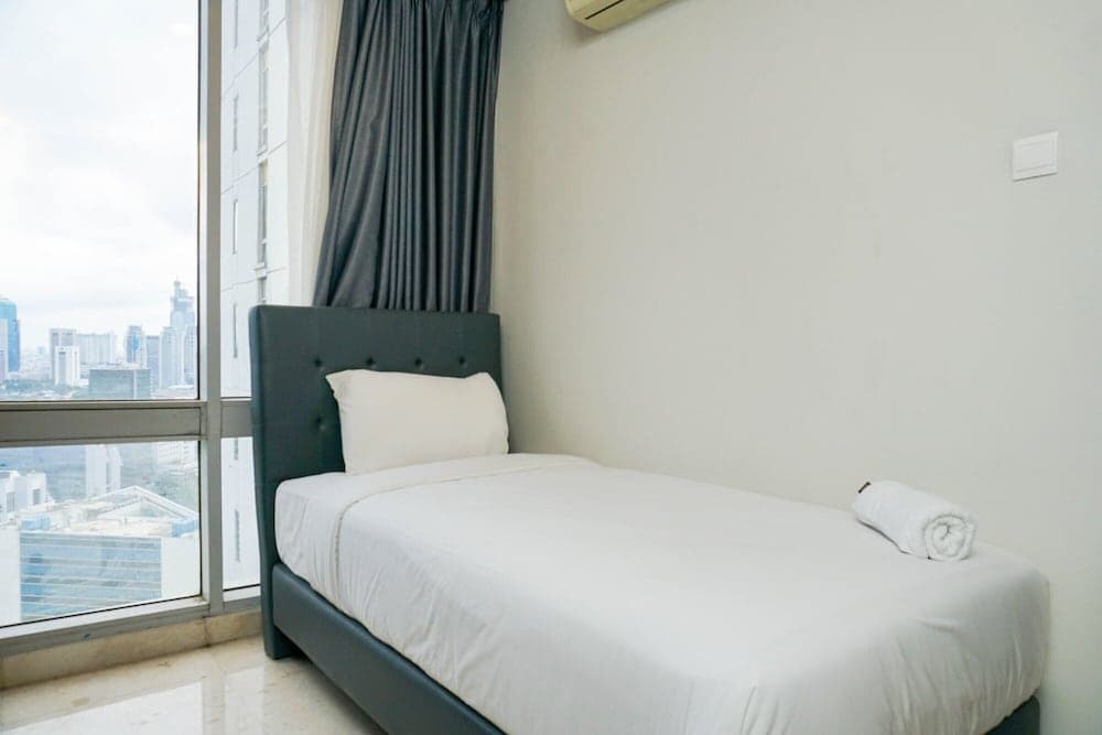 Cozy 2BR at Empyreal Epicentrum Apartment By Travelio