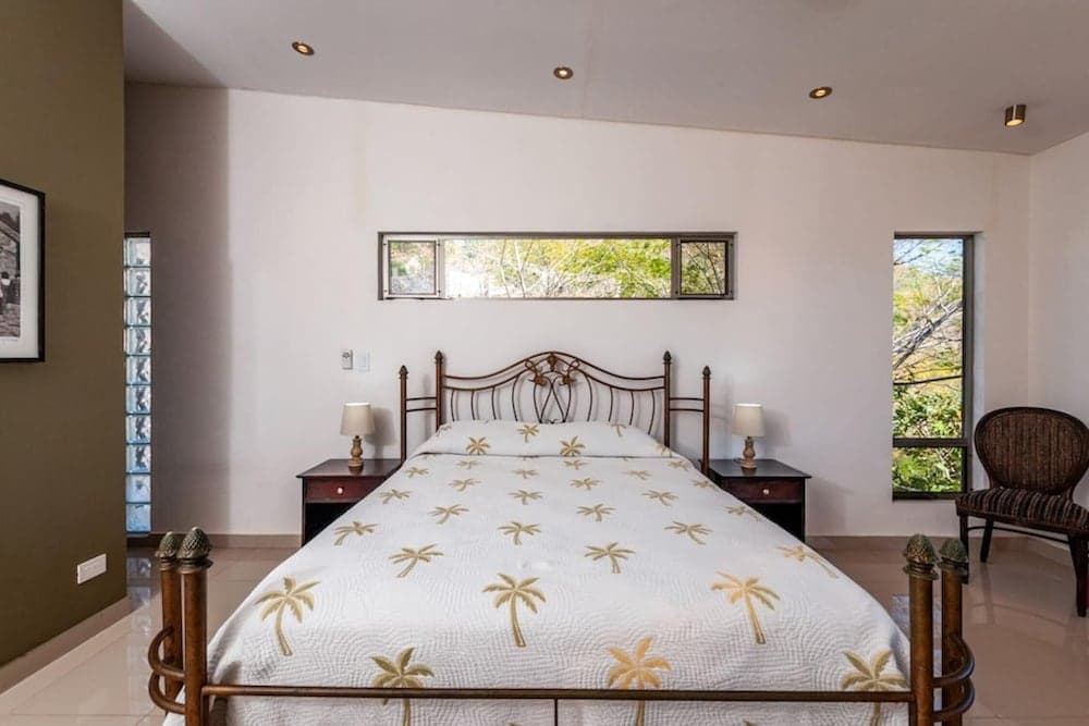 Modern Hillside Home with Sleek Interiors and Panoramic Poolside Views