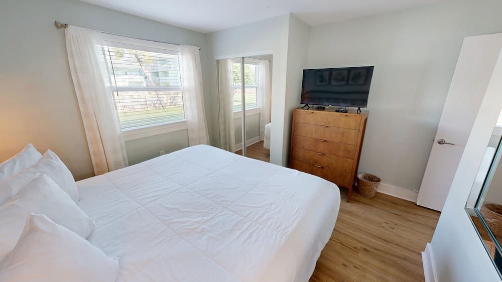 Ground Floor Pool Front Condo Sleeps 8 with easy beach access by RedAwning