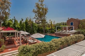 Dine on the Generous Veranda at a Rustic Stone Getaway