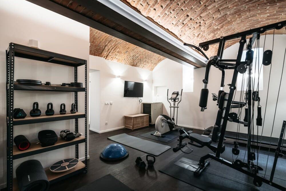 An Elegant Cozy Apartment Filled With Pieces of art gym spa Transport