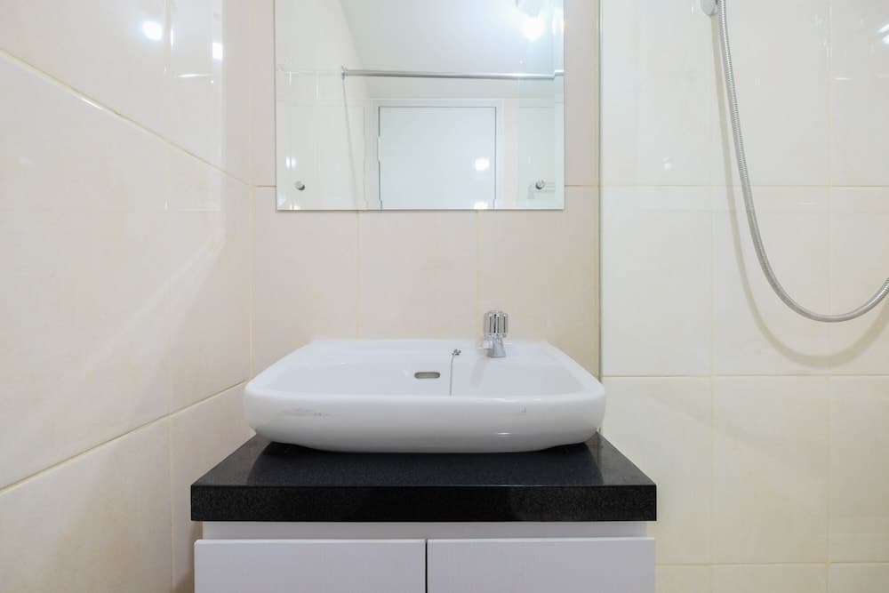 Modern White Studio At Springlake Summarecon Bekasi Apartment By Travelio