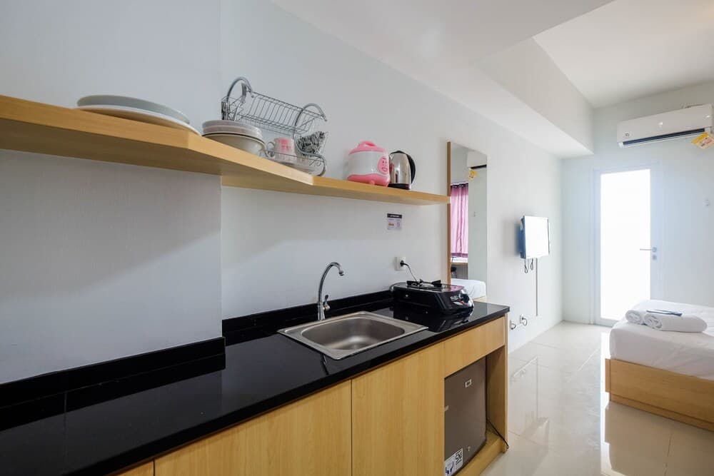 Homey and Comfy Studio Tamansari Mahogany Apartment
