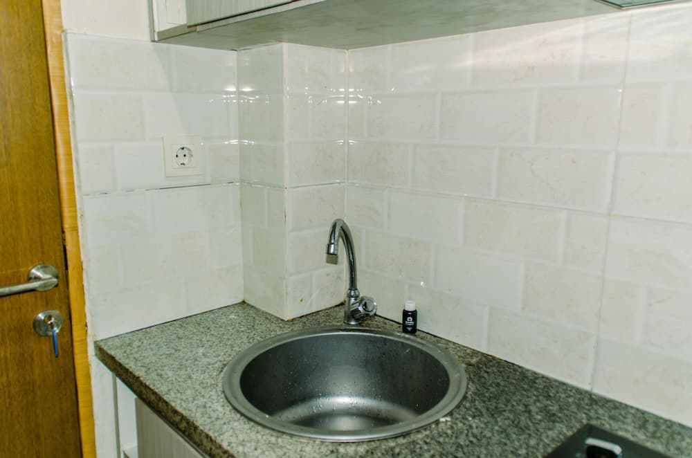 Homey And Warm Studio Room At Tifolia Apartment