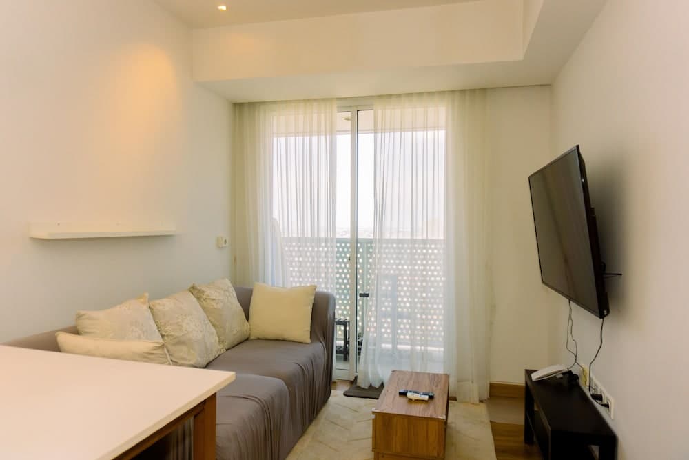 Spacious 1BR with Japandi Design at West Vista Apartment By Travelio