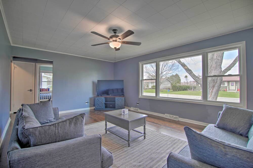 Cottage w/ Sunroom & Fire Pit, Walk to Lake!