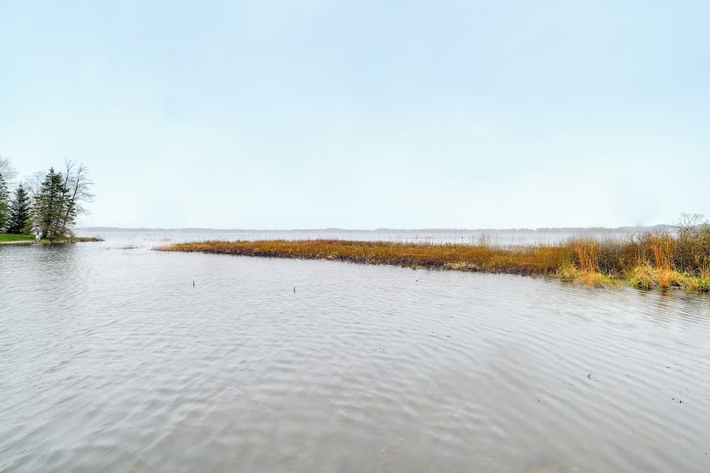 Cadillac Vacation Rental w/ Dock on Lake Mitchell!