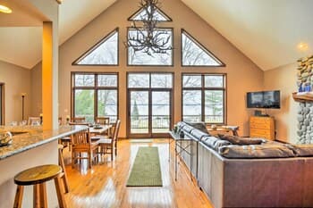 Lakefront Roscommon Home w/ Dock, Patio, & Games!