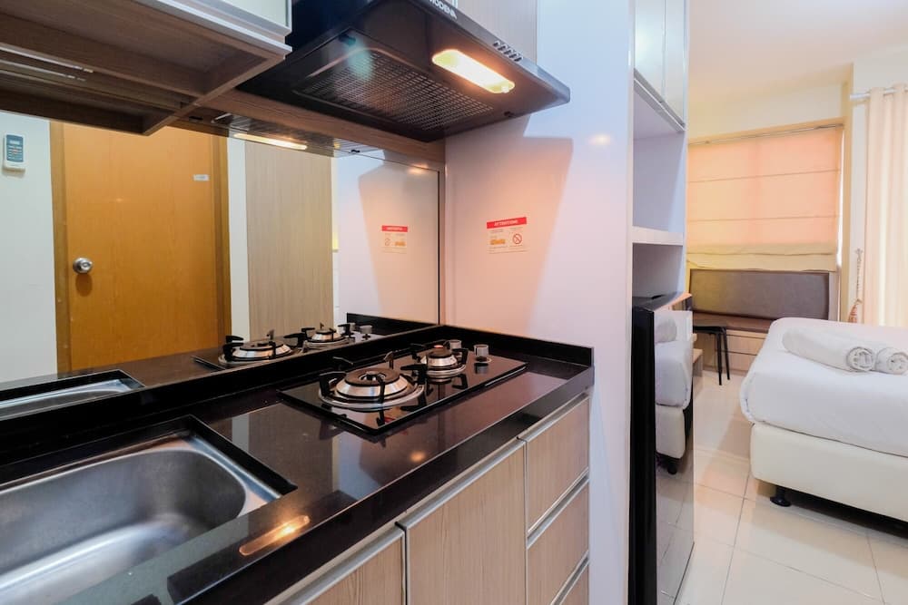 Minimalist Studio Room with City View @ Tifolia Apartment