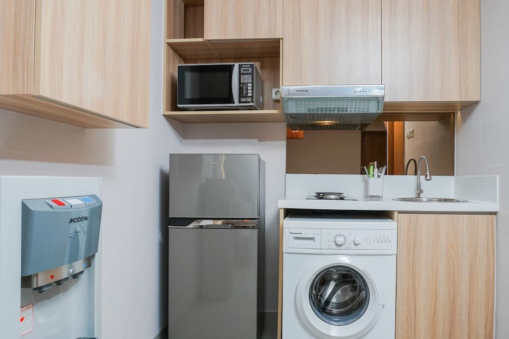 Clean and Elegant 1BR at The Oasis Apartment