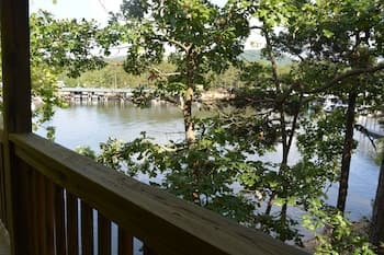 Lake View two Bedroom, two Bath Log-sided, Luxury Harbor North Loft Cottage With hot tub Overlooking Lake Ouachita. by Redawning