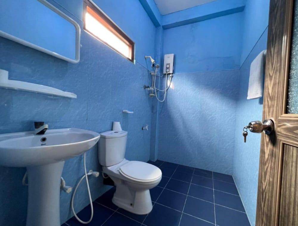 Malika's Yellow House