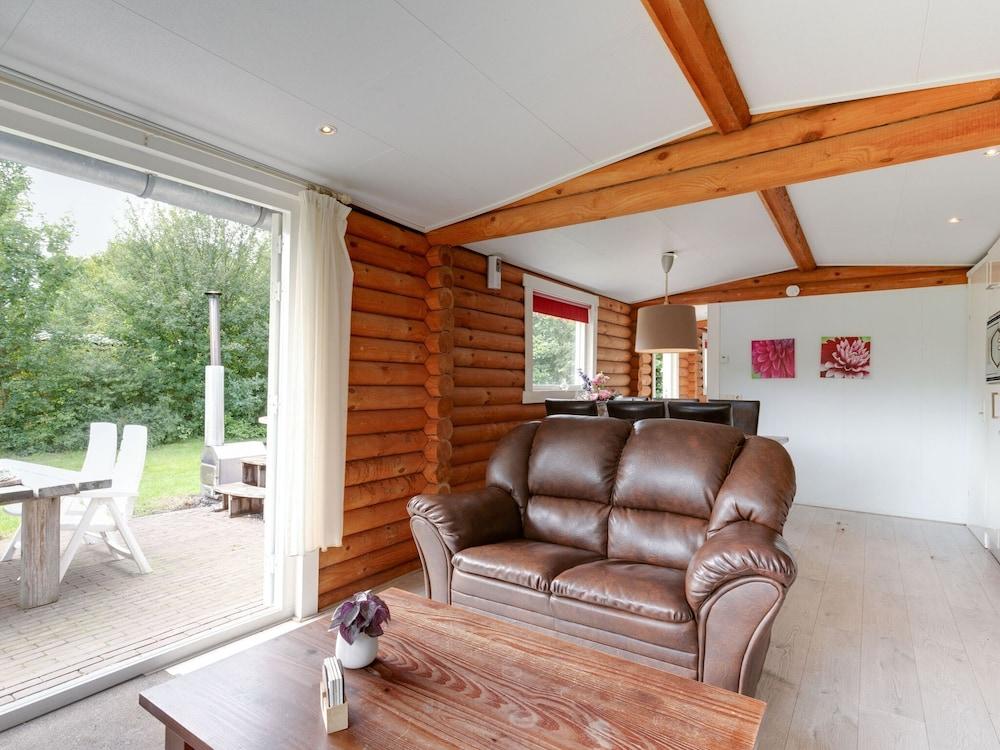 Wooden Tree Trunk Bungalow at Fish Pond in Hoge Hexel, Optional With hot tub