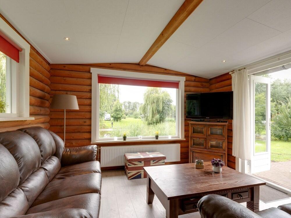 Wooden Tree Trunk Bungalow at Fish Pond in Hoge Hexel, Optional With hot tub