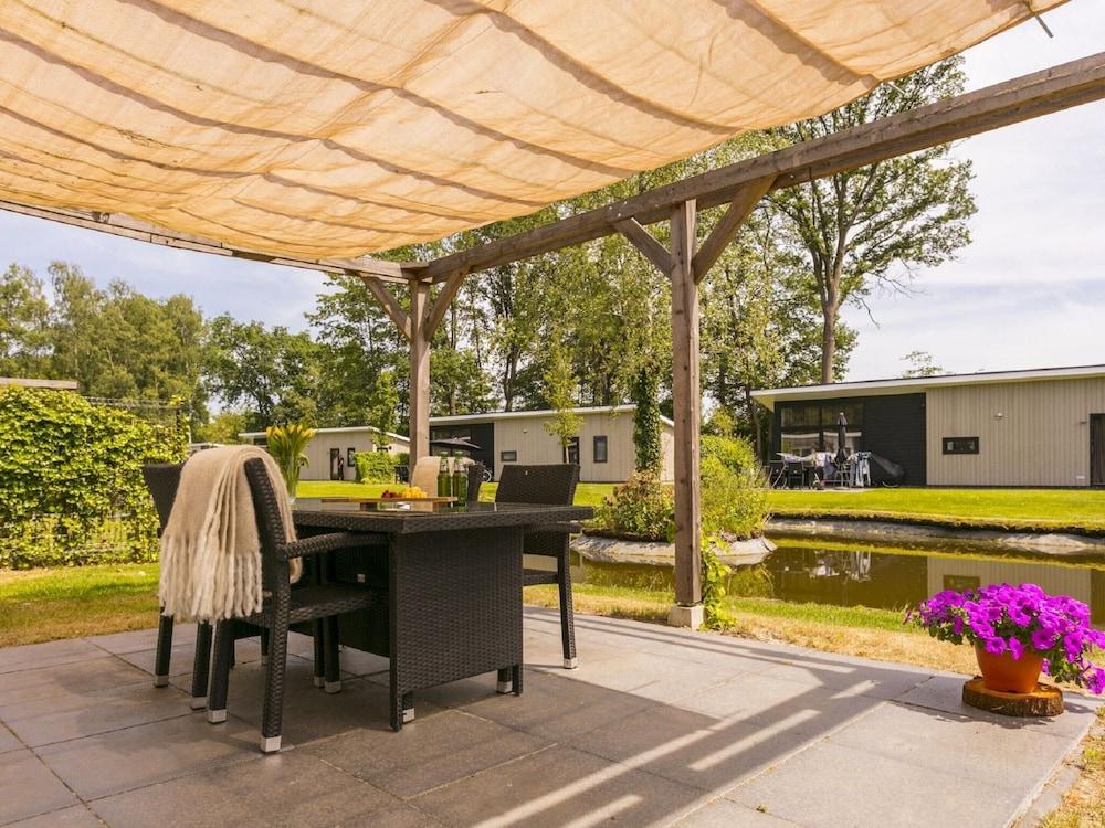 Sunlit Chalet by the Pond