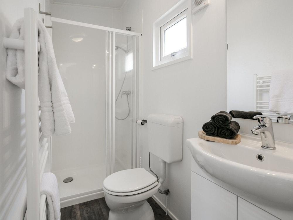 Sunlit Chalet by the Pond