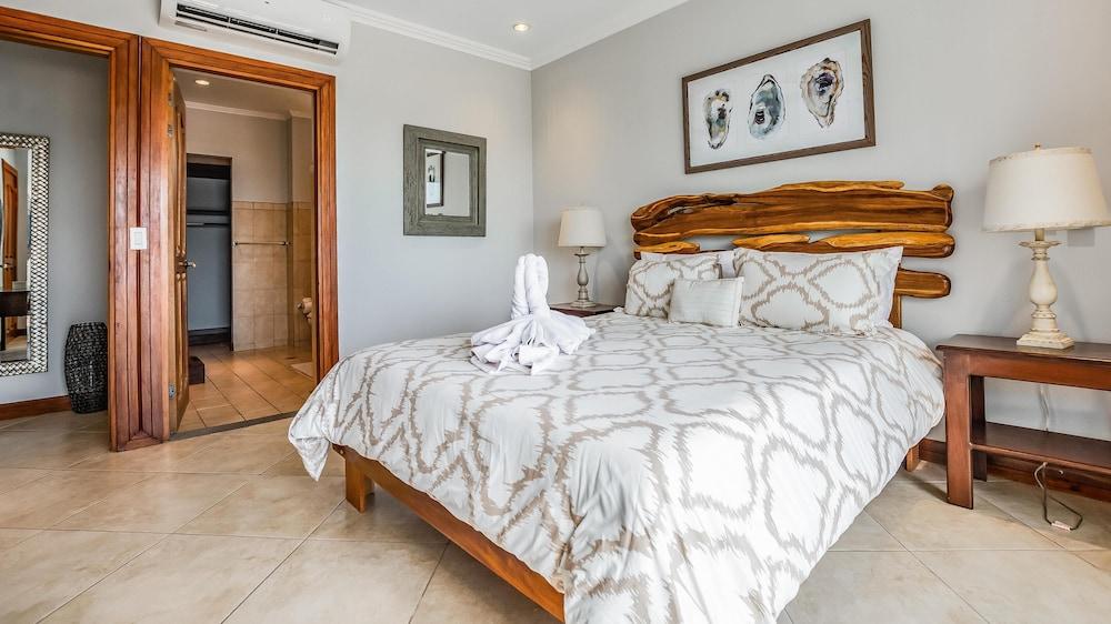 Elegant Oceanview Condo with Spacious Open-Concept Floor Plan and Inviting Beach Design